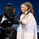NEW YORK, NEW YORK - DECEMBER 08: Chloe Bailey (R) accepts an award onstage from Loni Love (L) during the 13th Annual Root 100 Gala at The Apollo Theater on December 08, 2022 in New York City.